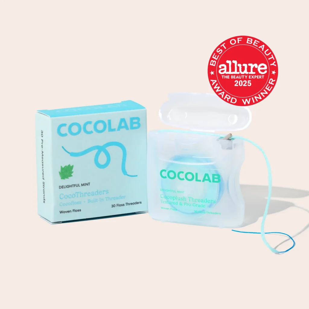 Packaging and dispenser for COCOLAB CocoThreaders, highlighting their "Allure Best of Beauty Award 2025" status and built-in threader design for easy flossing.