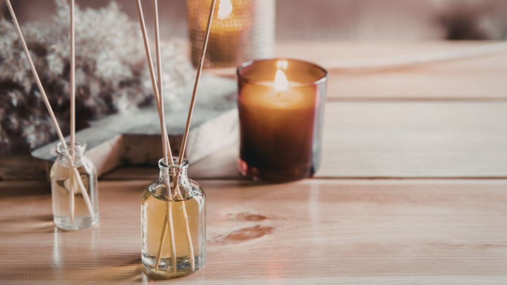 A welcoming view of a dental office reception area with calming essential oil diffusers, soft lighting, and a digital check-in tablet, creating a spa-like atmosphere for new patients.