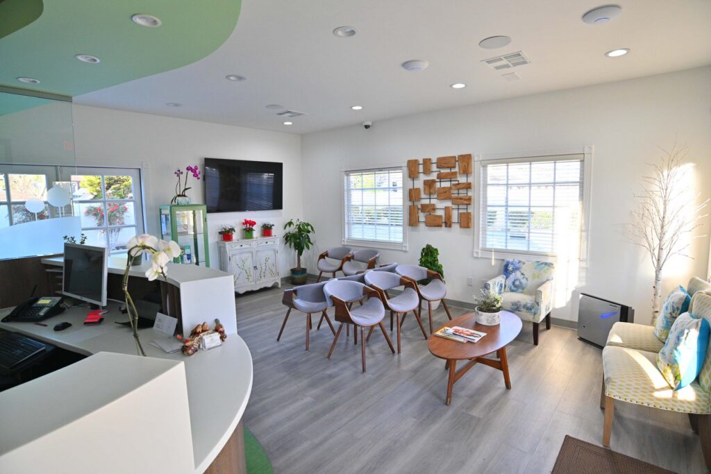 The welcoming reception and community space at Wellbeing Dentistry in Santa Clara, CA, where Dr. Pak hosts her monthly wellness book club.
