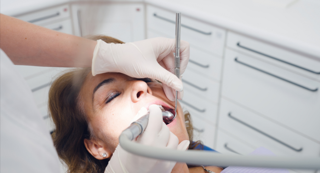 Close-up of a biological dental procedure at Wellbeing Dentistry 3.0 utilizing ozone gas to disinfect a treatment area and promote rapid tissue healing.
